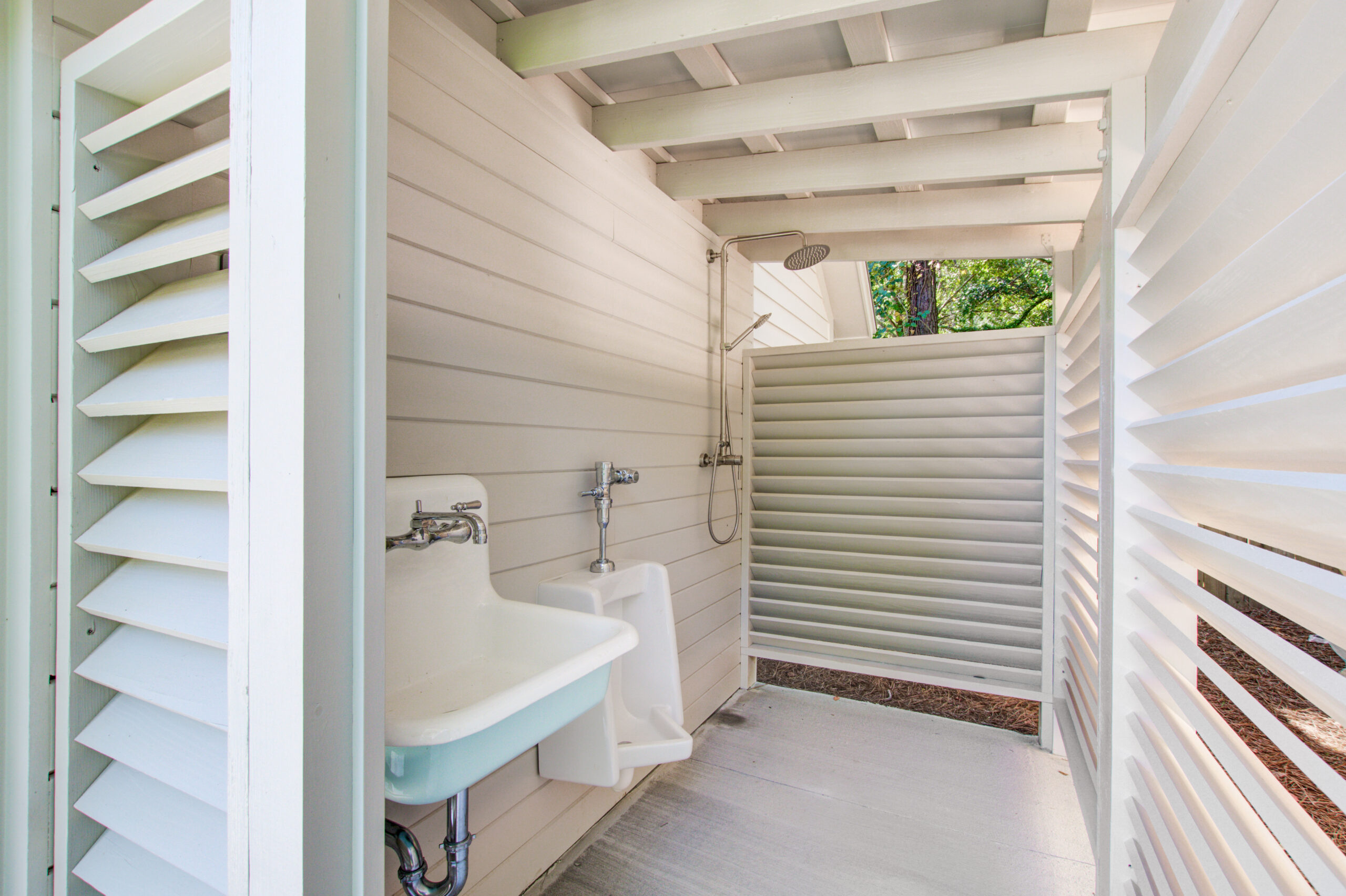 Shutter Walls Enclose The Outdoor Shower with Sink and bathroom -- CK Contracting -- Custom Home Renovations -- Mount Pleasant, SC.