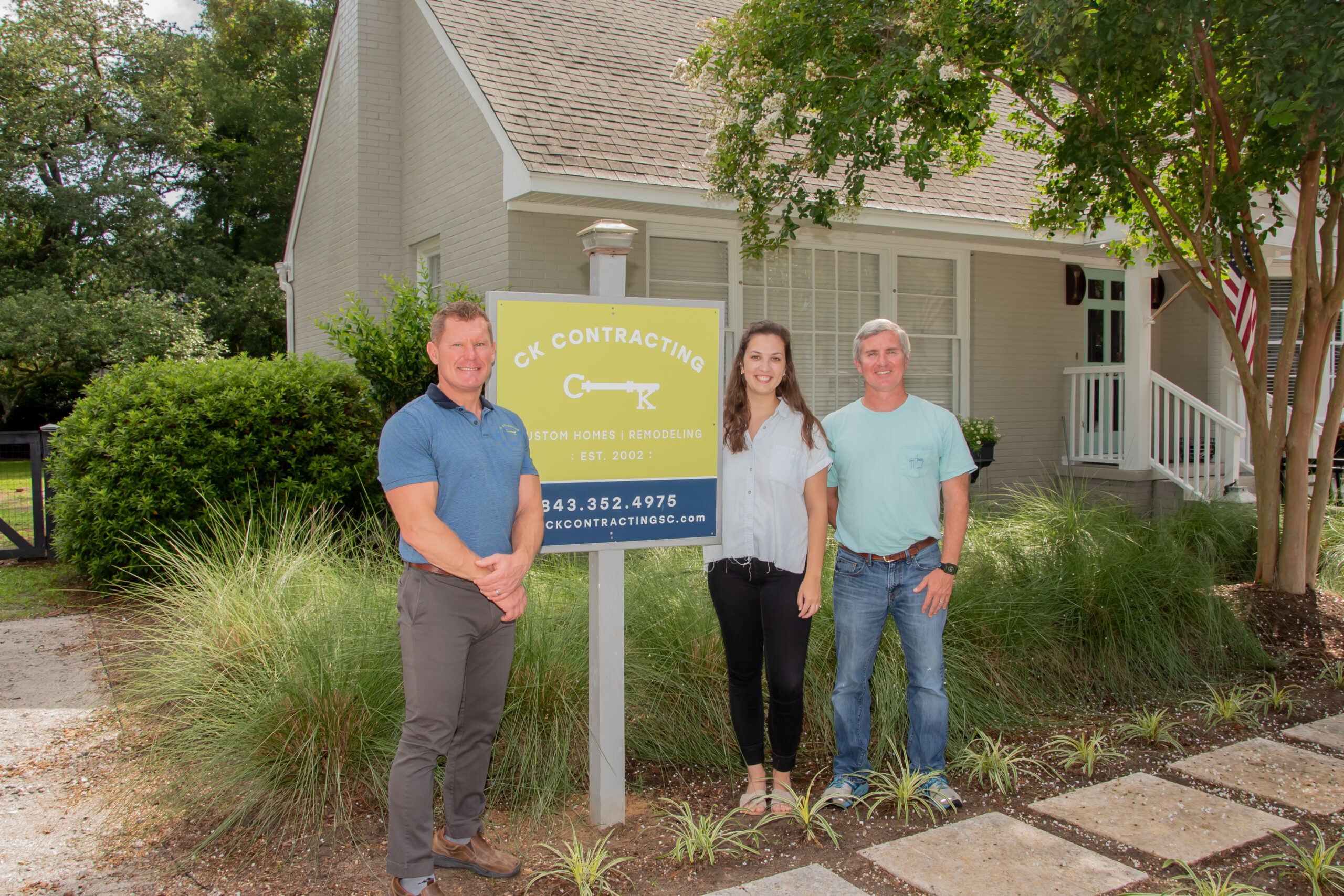 Christopher Click and his staff standing by the CK Contracting sign for in front of a New Home Builder project in Mt Pleasant SC