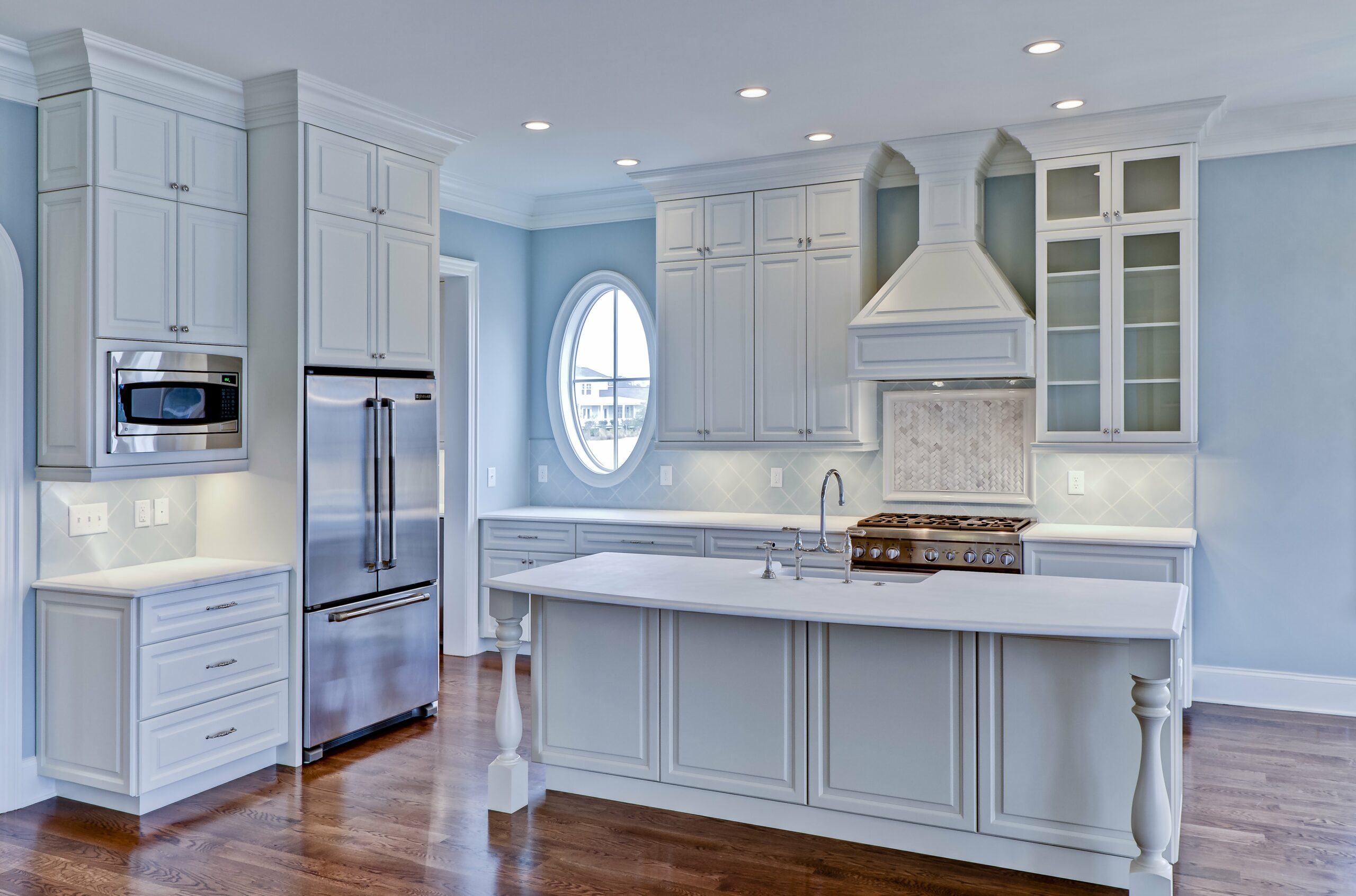 Light blue kitchen with white island and window. Kitchen remodeling mount pleasant sc