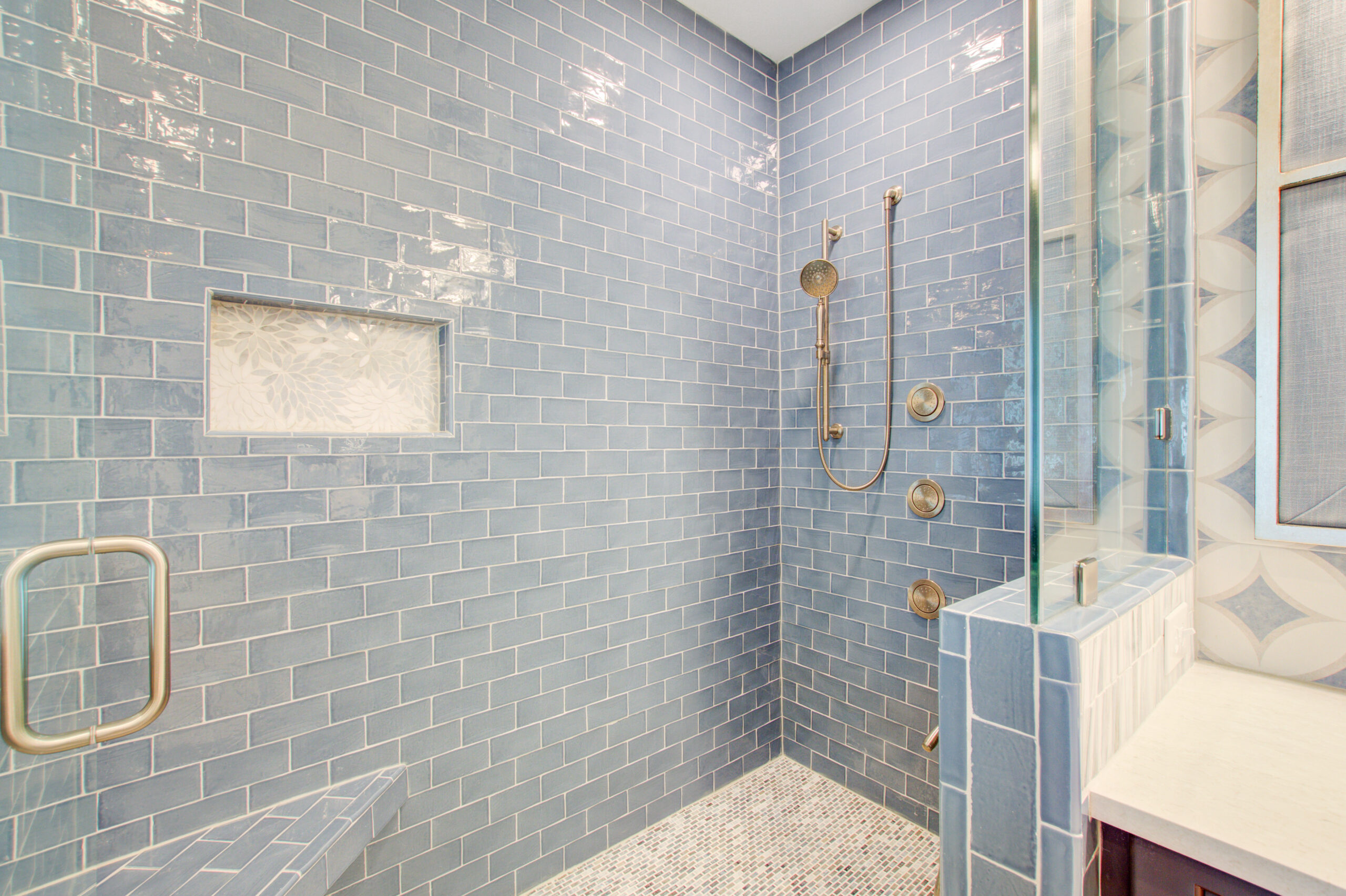 Blue Subway Title Shower with a shower niche. -- CK Contracting - Custom Renovations, Mountain Pleasant, SC.